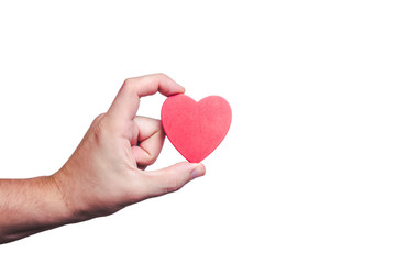 Fototapeta premium Male hand holding red wooden heart shape background.