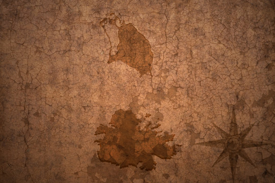 antigua and barbuda map on a old vintage crack paper background
