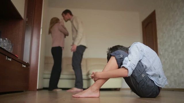 boy is present at a quarrel parents. father beat her mother. stress in a child