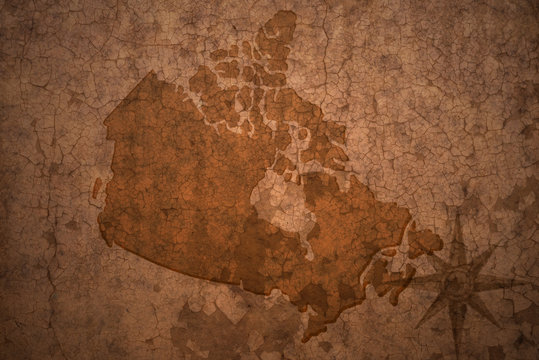 canada map on a old vintage crack paper background