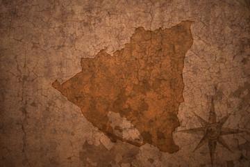 nicaragua map on a old vintage crack paper background