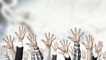 Group of people with raised hands