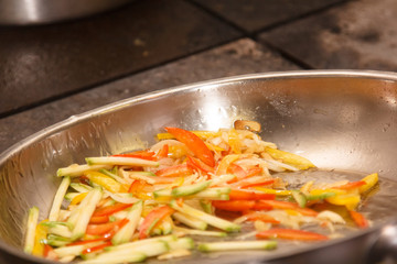 Vegetables for the sauce to pasta fried in a pan.