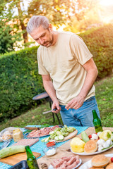 Man preparing food for barbecue