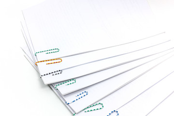 Paper clips and file on white  background