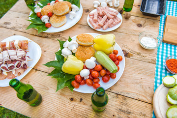Fototapeta na wymiar Table with food and drink ready for barbecue party