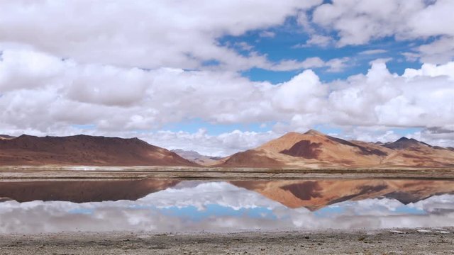 4K Ultra HD : White clouds timelapse over the mountain wich reflected in Tso Kar lake, Ladakh, North India