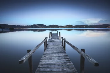 Printed roller blinds Pier Wooden pier or jetty on a blue lake sunset and sky reflection on