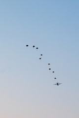 Airplane Drops Parachutes
