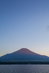 Red color at Top of Mountain Fuji during sunset at Yamanaka lake in summer
