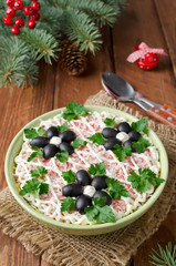 Salad with crab sticks, cheese, egg and prunes