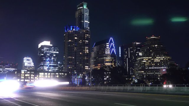 A nighttime time lapse view of traffic on the South 1st Street Bridge in downtown Austin, Texas.  	