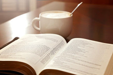 Holy Bible Open on a Wooden Table