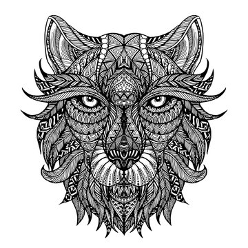 Ethnic patterned ornate hand drawn head of wolf. Black and white