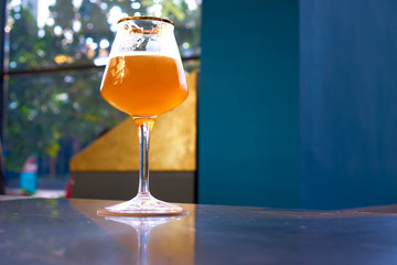 cold beer glass on bar or pub desk