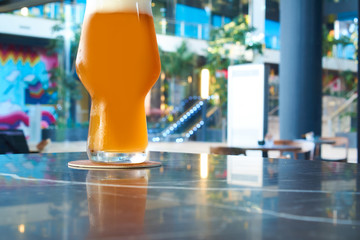 cold glass of beer in pub