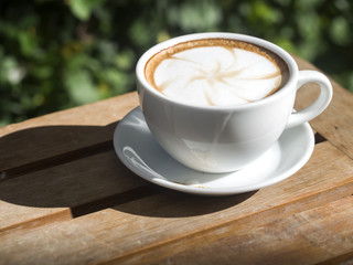 Coffee cup with on wooden table ,soft focus
