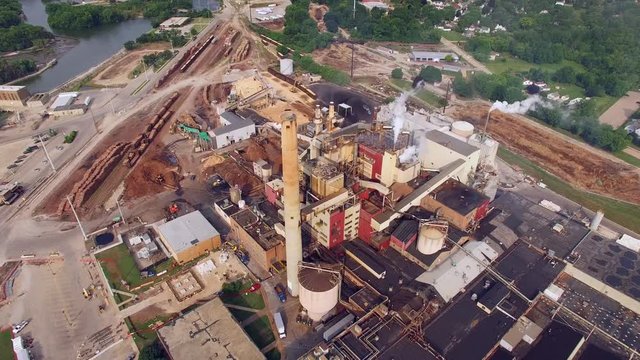 Breathtaking Aerial Flyover of Factory, Smoke Stack, Industrial, Paper Mill
