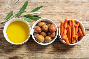 Olives and olive oil in bowls