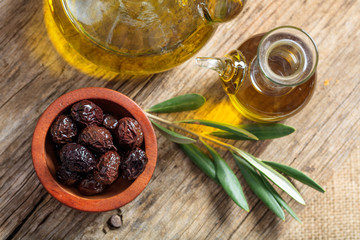 Olives and olive oil on a table