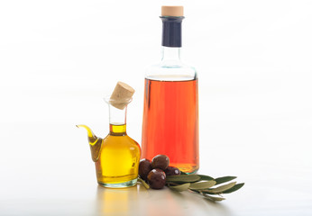 Olive oil and vinegar on white background
