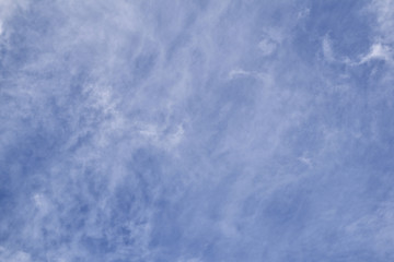 blue sky background with tiny clouds
