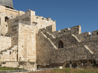 Section of Jerusalem Old City wall with narrow stairs, adjoining Dome of the Rock