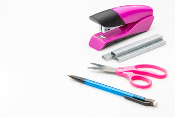 Stapler, staples, scissors and mechanical pencil.