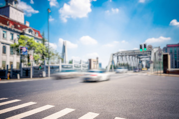 Shanghai street view with cityscape in background.