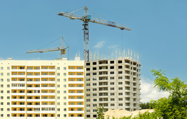 Fototapeta na wymiar Crane and building construction on sky background