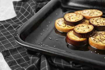 Sliced eggplant on baking tray
