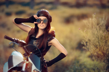 Obraz na płótnie Canvas Cosplay Steampunk Woman Next to Her Motorcycle 