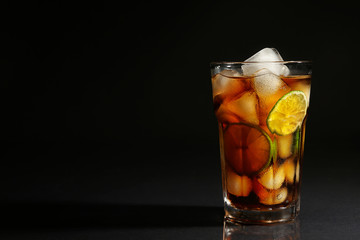 Cuba libre cocktail on dark background