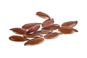 Close up of flax seeds isolated on white background