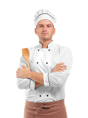 Young chef cook with wooden cutlery isolated on white