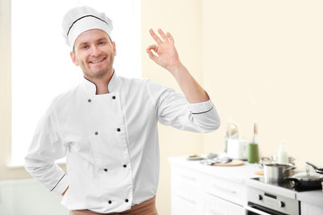 Young chef cook in kitchen