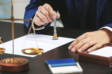 Notary public in office stamping document