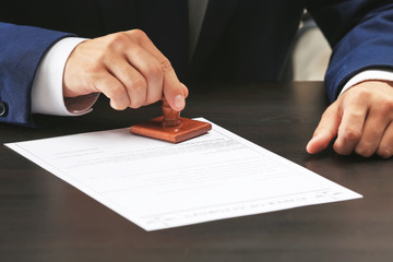 Notary public in office stamping document