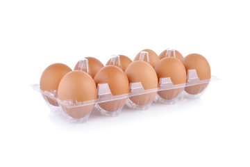 eggs in transparent tray package on white background