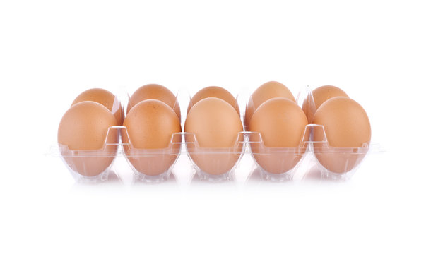 eggs in transparent tray package on white background