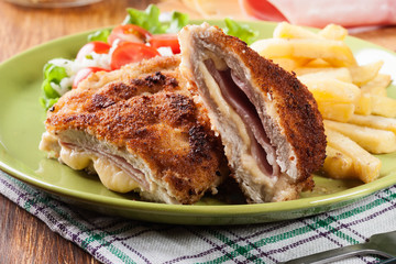 Cutlet Cordon Bleu with pork loin served with French fries and salad