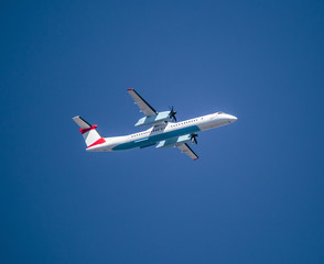 Propeller passanger airplane on blue sky