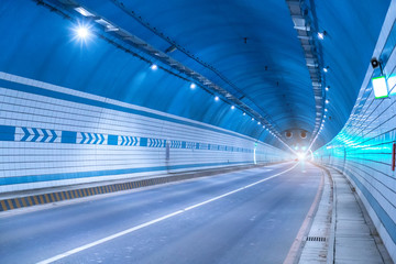 Fototapeta na wymiar Abstract speed motion in urban highway road tunnel, blurred moti