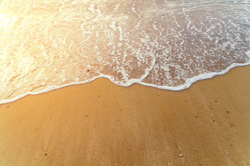 Fototapeta na wymiar Beach and ocean early in the morning with burning sun