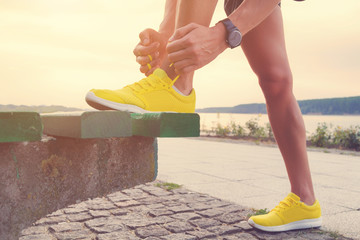 Tying running shoes.