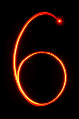 red light painting number six on black background
