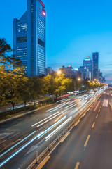 Obraz premium traffic light trails on urban street in city of China.