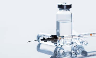 medicament in a glass vial and syringe