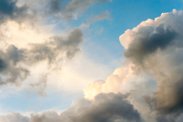 Gloomy dark dramatic cloudy sky background with fleecy curly clo