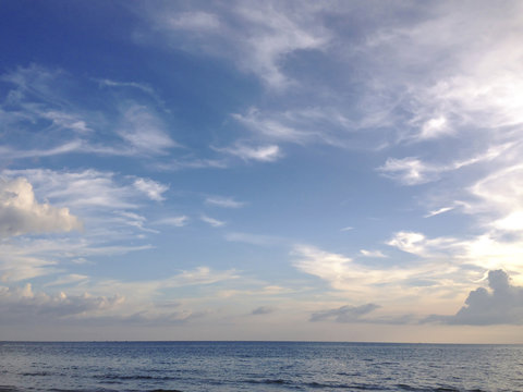 the evening sky over the quiet sea